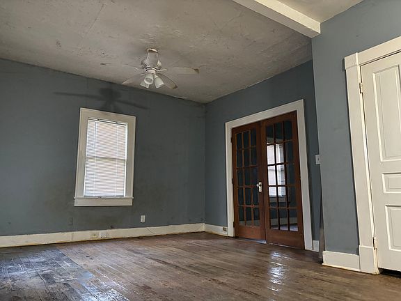Family room looking at French doors into wood stove bedroom.