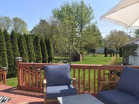 Deck off the dining room and Kitchen area. You can see the detached garage on the right hand side of this photo.