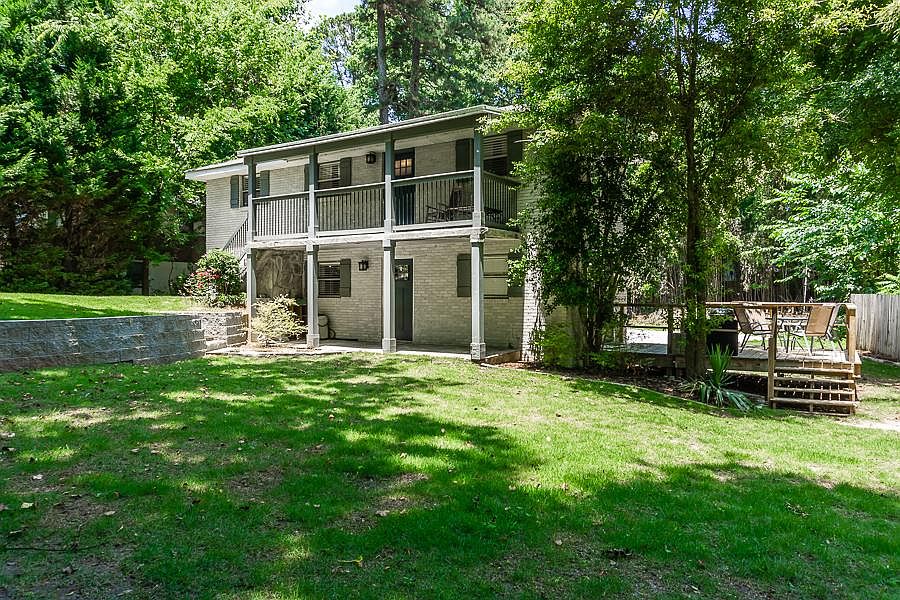 Front view of the property with a spacious yard.