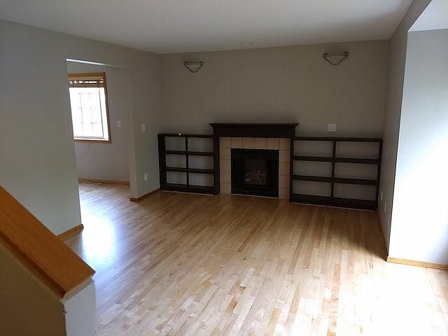 Living room with fireplace and built-in shelves