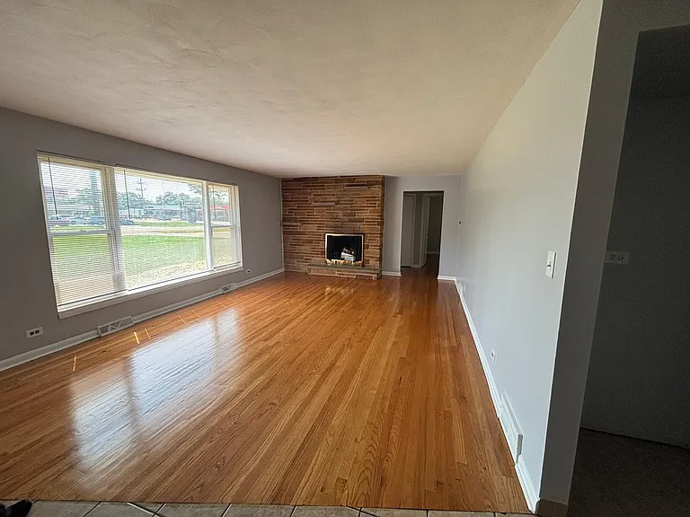 Living room with wood burning fire place