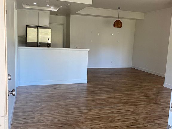 Entering the great room with living, dining and kitchen space.