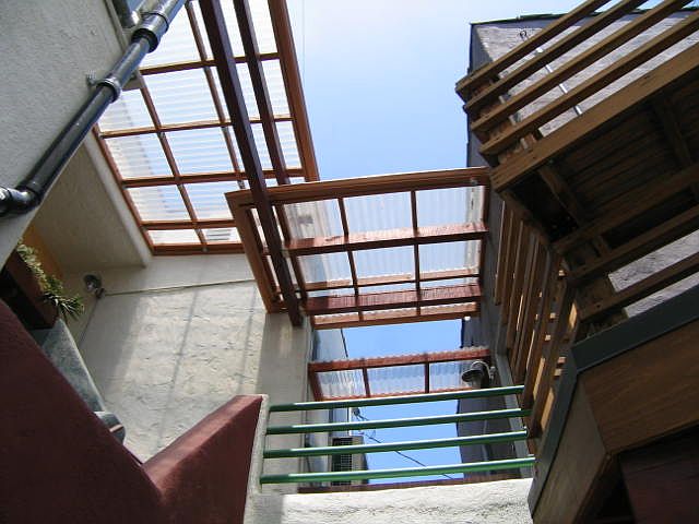 Rear entrance to town flat is covered by skylights