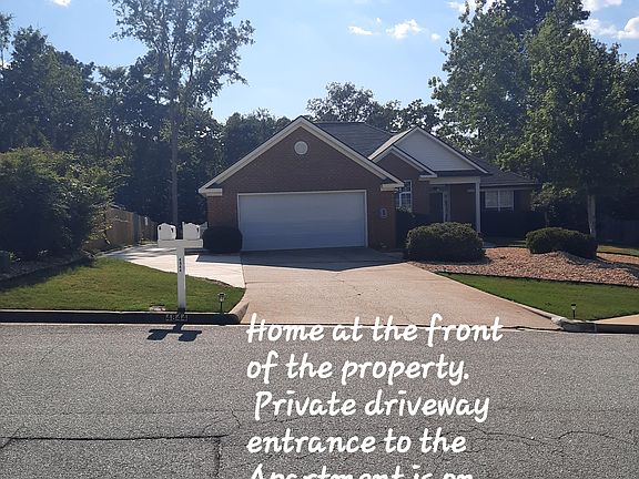 Street view of home on the front of the property, driveway to rear Apartment is on the left.