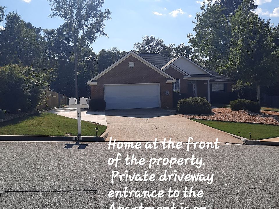 Street view of home on the front of the property, driveway to rear Apartment is on the left.