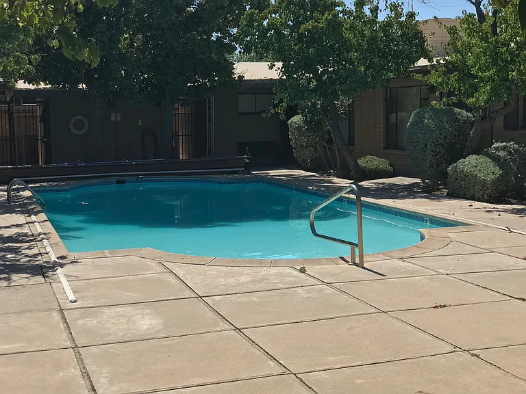 The community pool is well-maintained and shared by only 12 units.
