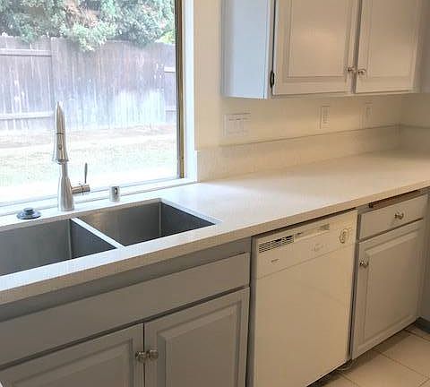Kitchen with new quartz countertop, new sink and faucet