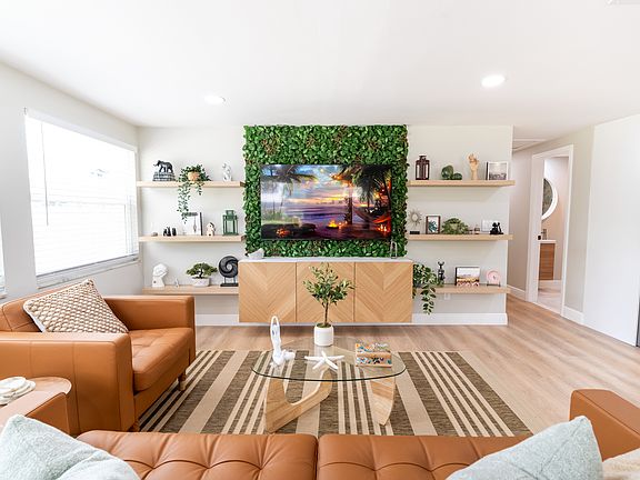 Bright living room with 65-inch Smart TV.