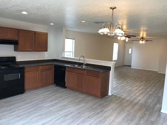 Kitchen/Living Room w/ newly laid tile floor.