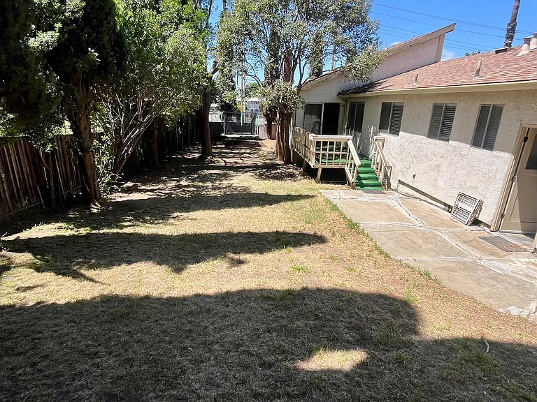 Large back yard with automatic sprinklers