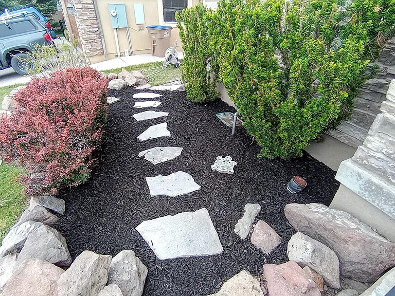 Pathway to private backyard entrance to lower-level walkout apartment,