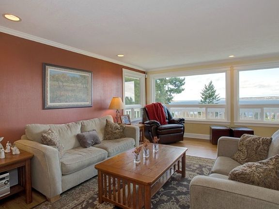 Great living space...kitchen opens to dining area & living room. Ideal for entertaining! Designer colors, crown molding, recessed lighting and a wall of windows overlooking Puget Sound!