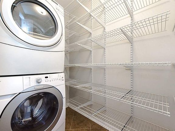 Large full size front load Washer and Dryer included. Pantry with Closet System Tile Floor