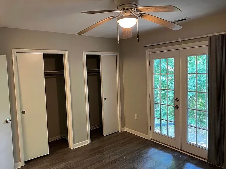 Enjoy a comfortable basement bedroom with beautiful French doors that open directly onto the outdoor deck, bringing in natural light and providing convenient access to the outside. The room also features generous closet space, making it a versatile and in