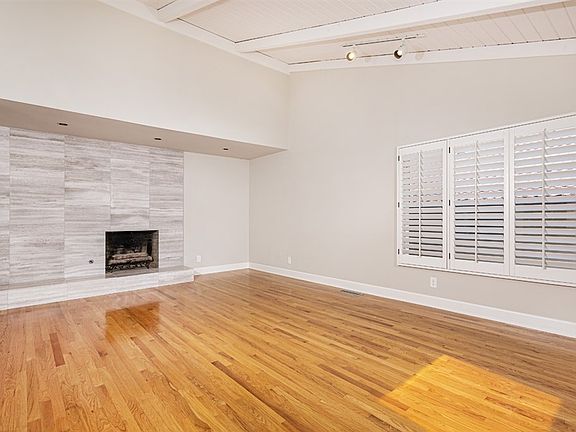 The front of the house looks like it is a one story however it is a multi level house with a large office in the lower level. The office has a separate entrance and built ins throughout.