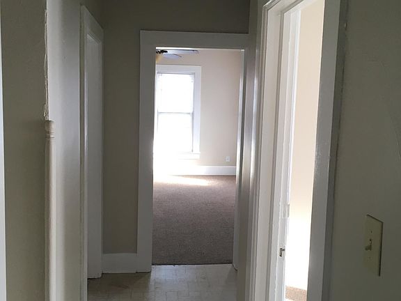 hallway. Bedroom door on right/Kitchen door on left/living r