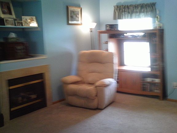 Living room with gas fireplace.