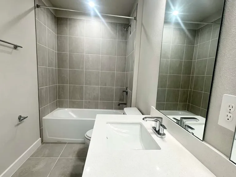 2nd bathroom room, with double sink and bath tub