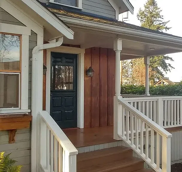 Front entry and porch with view of water