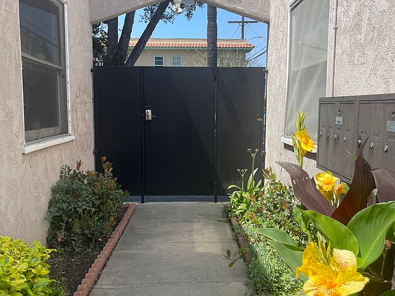 Inside of Front gate with security camera facing interior walkway