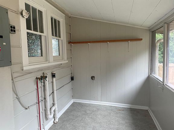 Laundry room with washer dryer hookups and space for storage