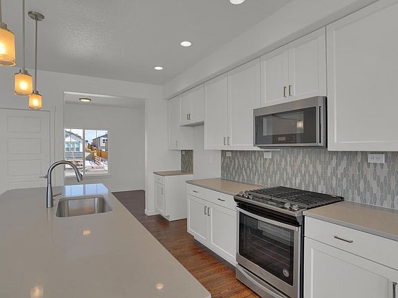 Kitchen opens to flex space. Photo representing home to be built and may demonstrate optional featu