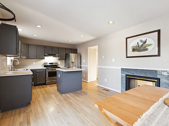 Eat-In Kitchen with Island Double Sided Fireplace