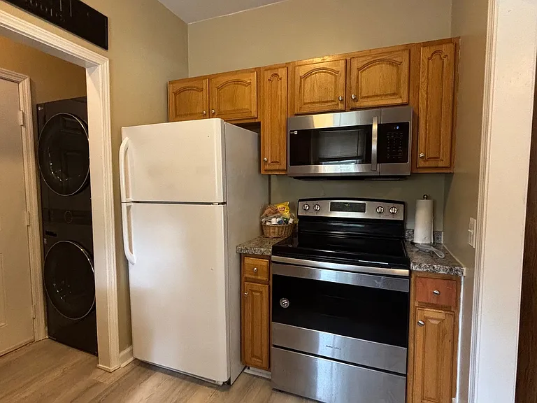 Smooth-top range, microwave, refrigerator, Washer and Dryer.
Nice sink and dishwasher on other side.