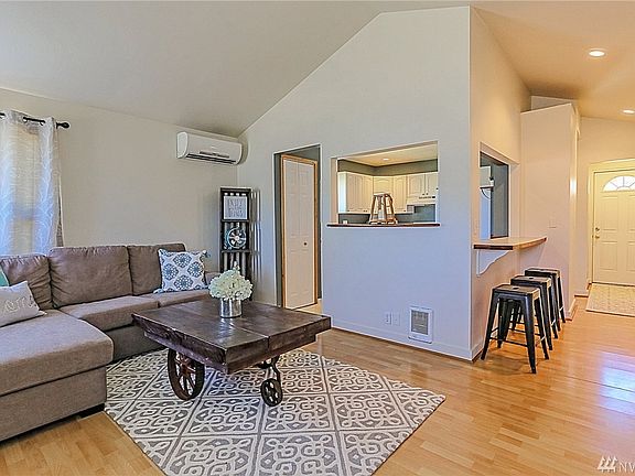 Entry, Living room, looking into kitchen and breakfast counter