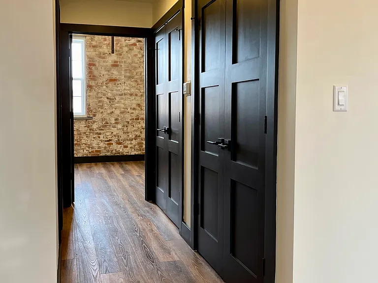 Utility closet stores the water heater and the washer/dryer unit.
