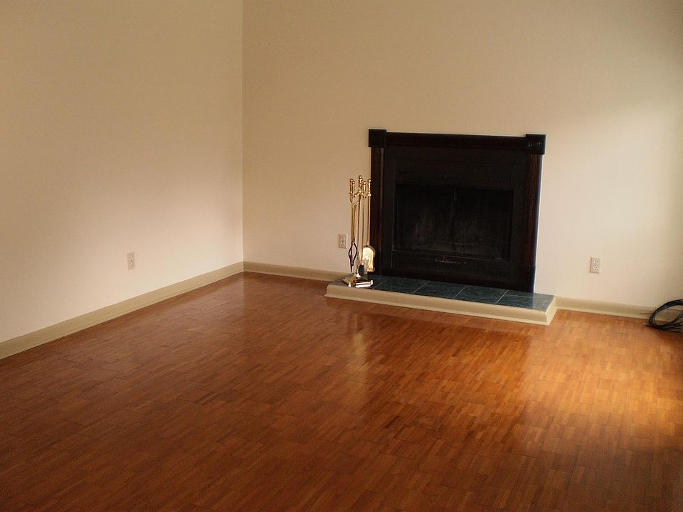 Living room with wood burning fireplace