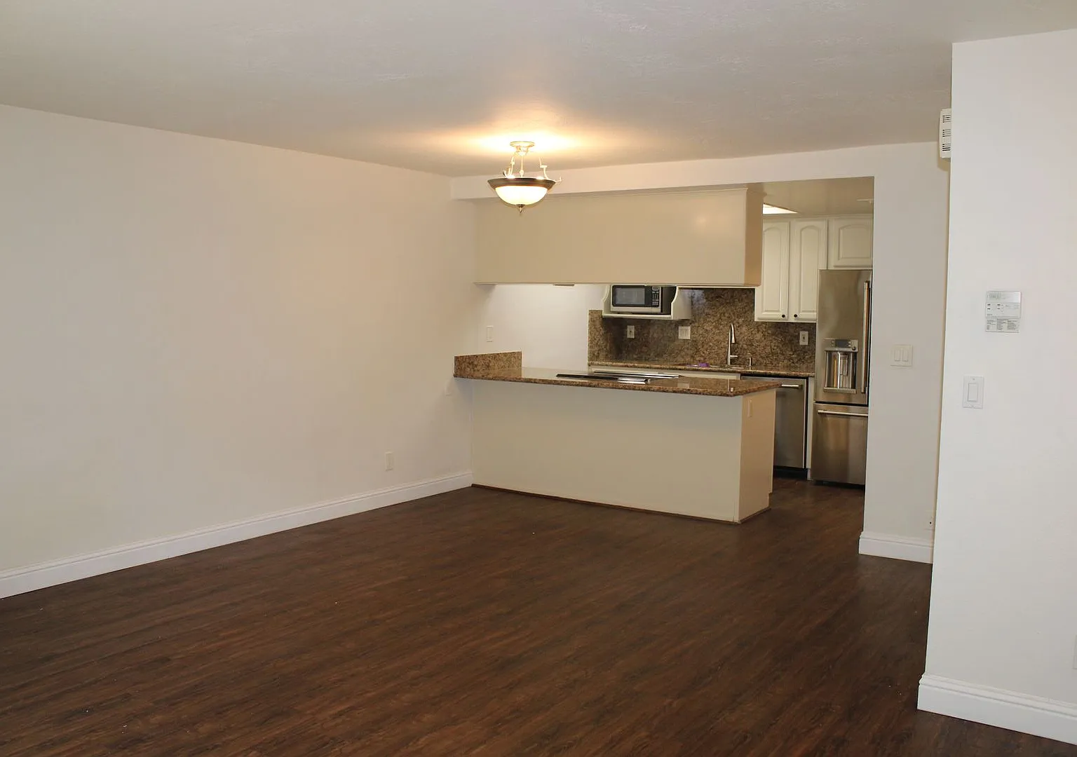 Adorable and Updated 2 Bedroom, 1 1/2 Bathroom End Unit in Sunset Park with Garage and Amenities! — Photo 4