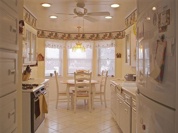 View of kitchen dining area from 3-season room