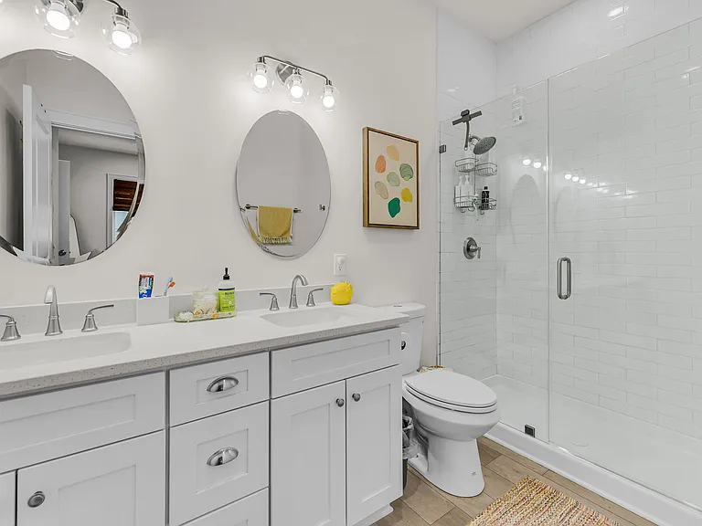 Master bath includes dual vanity with upgraded walk-in shower.