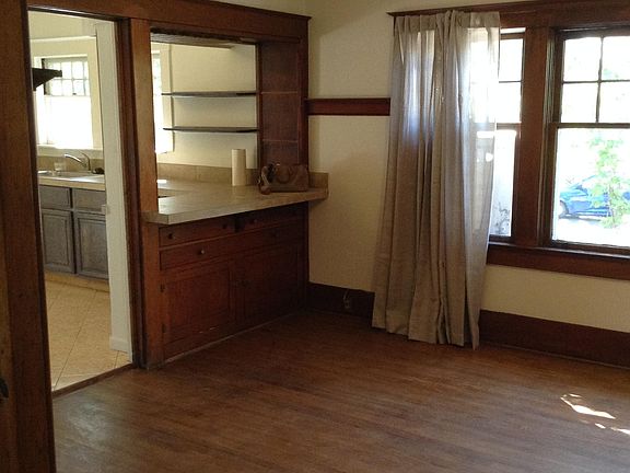 main living area w/ breakfast bar and built-in storage below