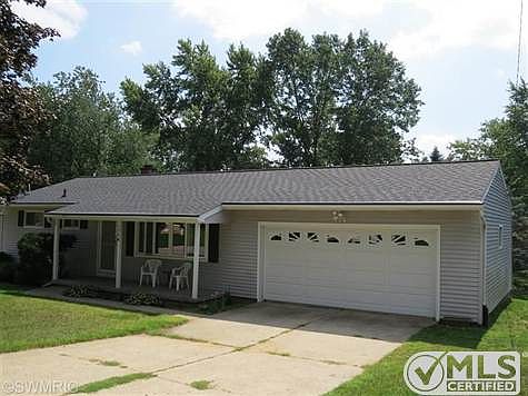 Front of home with porch.