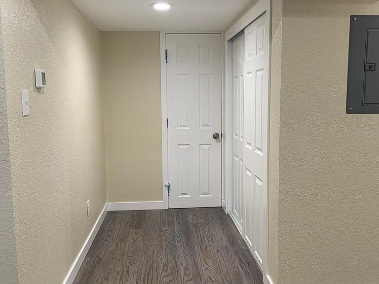 Spacious hall which could allow for placement of a desk or storage cabinets