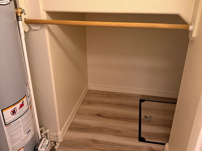 Under stairs closet and hot water heater.