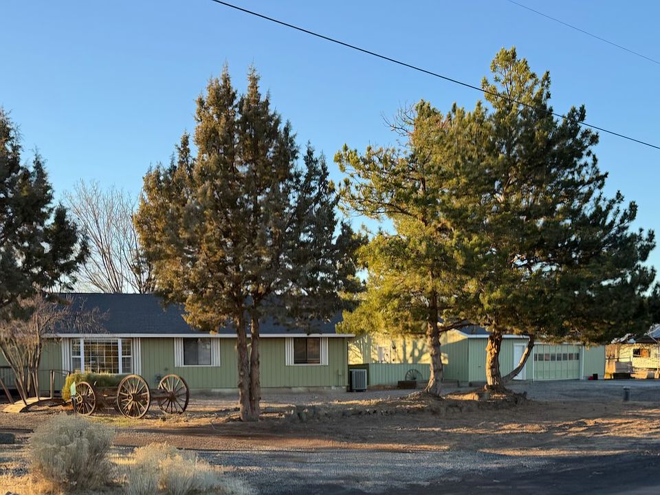 Home on acreage with barn and garage.