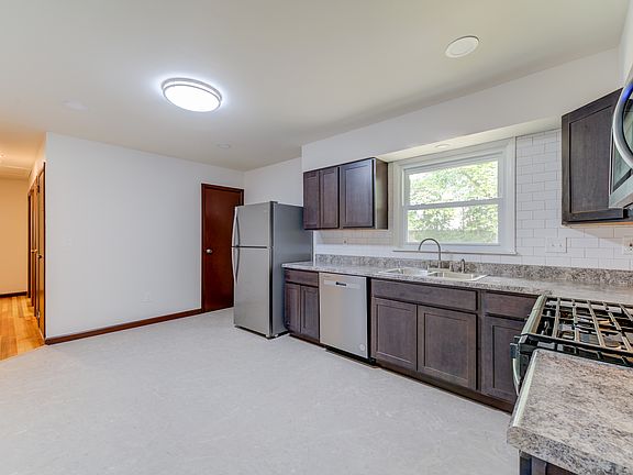 The kitchen has a pantry above the stairs to the basement.