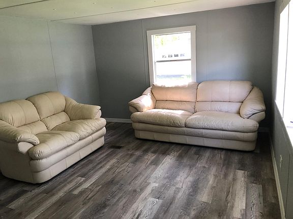 Living room has couch and loveseat