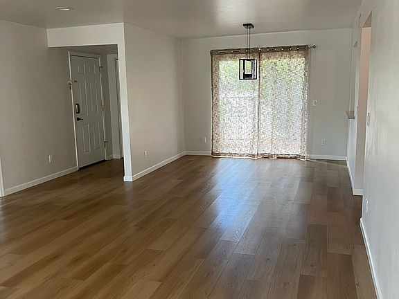 Living dining and entry way with access to front patio for a peaceful morning cup of coffee or tea