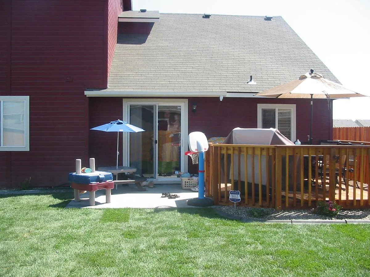 Private backyard with elevated deck, patio, and space for outdoor entertaining - 10598 Pipevine Dr