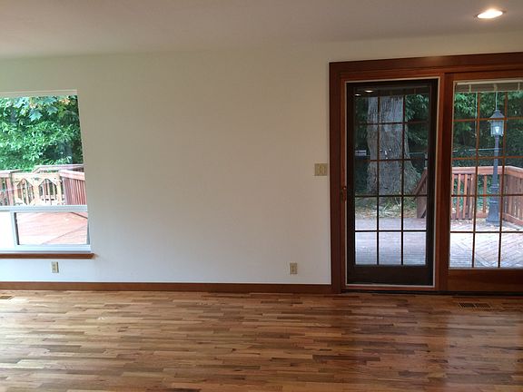 Living room with big slider to back yard and deck