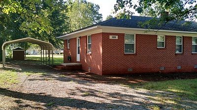 Entrance to the unit is located on the (left-hand) side of the building.
A detached single-car carport is provided for tenant use.
