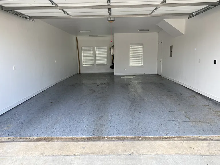 Three car garage (two cars tandem on left side)
