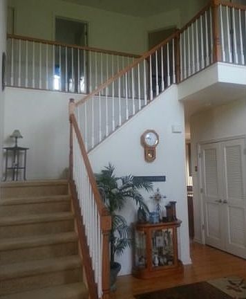 Dramatic staircase leading to 2nd floor