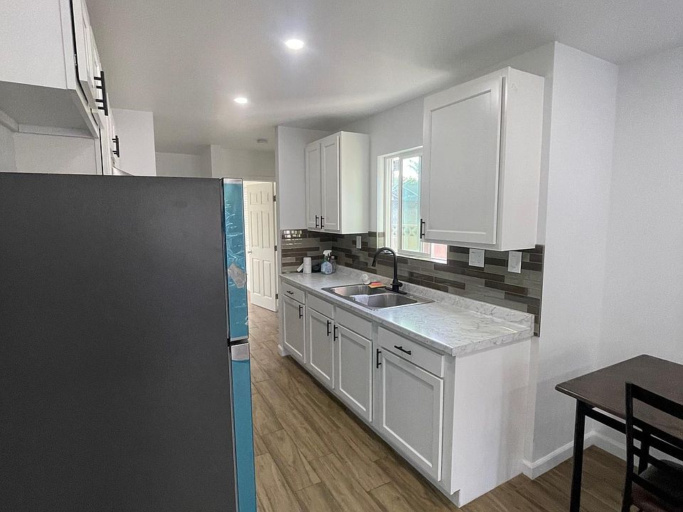 full kitchen with refrigerator
