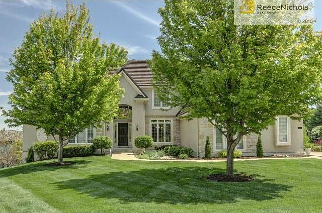 Just plain BEAUTIFUL!  Welcome home to side entry garage lush la