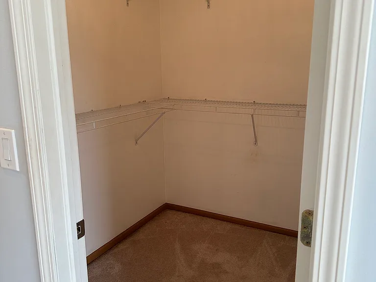 Walk in closet in master bedroom.